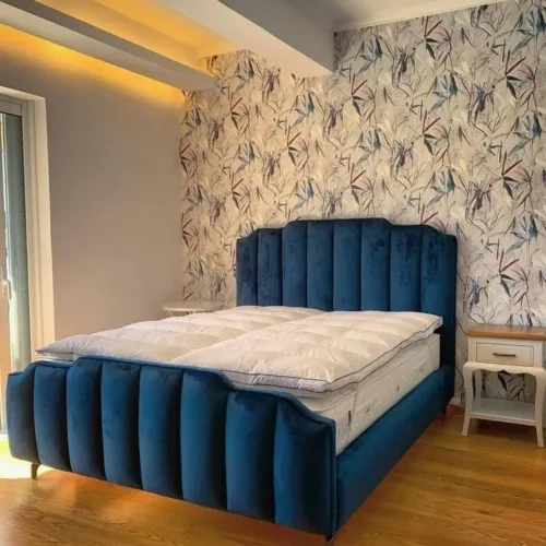 The SereneSoft Luxury Padding Double Bed is ideal for homeowners seeking a hotel-inspired sleeping experience. Its full padding offers superior comfort, while the sleek design keeps the look clean and sophisticated. The inner build is made in premium MDF Lasani, ensuring durability and long-term performance. Upholstered padding reduces impact and enhances overall comfort, making it suitable for everyday family use. Made on order with customizable colors, this bed adapts easily to evolving interior styles. Features Made in premium MDF Lasani structure Full padded body for added comfort Upholstered finish with luxury appeal Strong and stable base Color customization available Foam/mattress not included Recommended Size Standard Double Bed Size